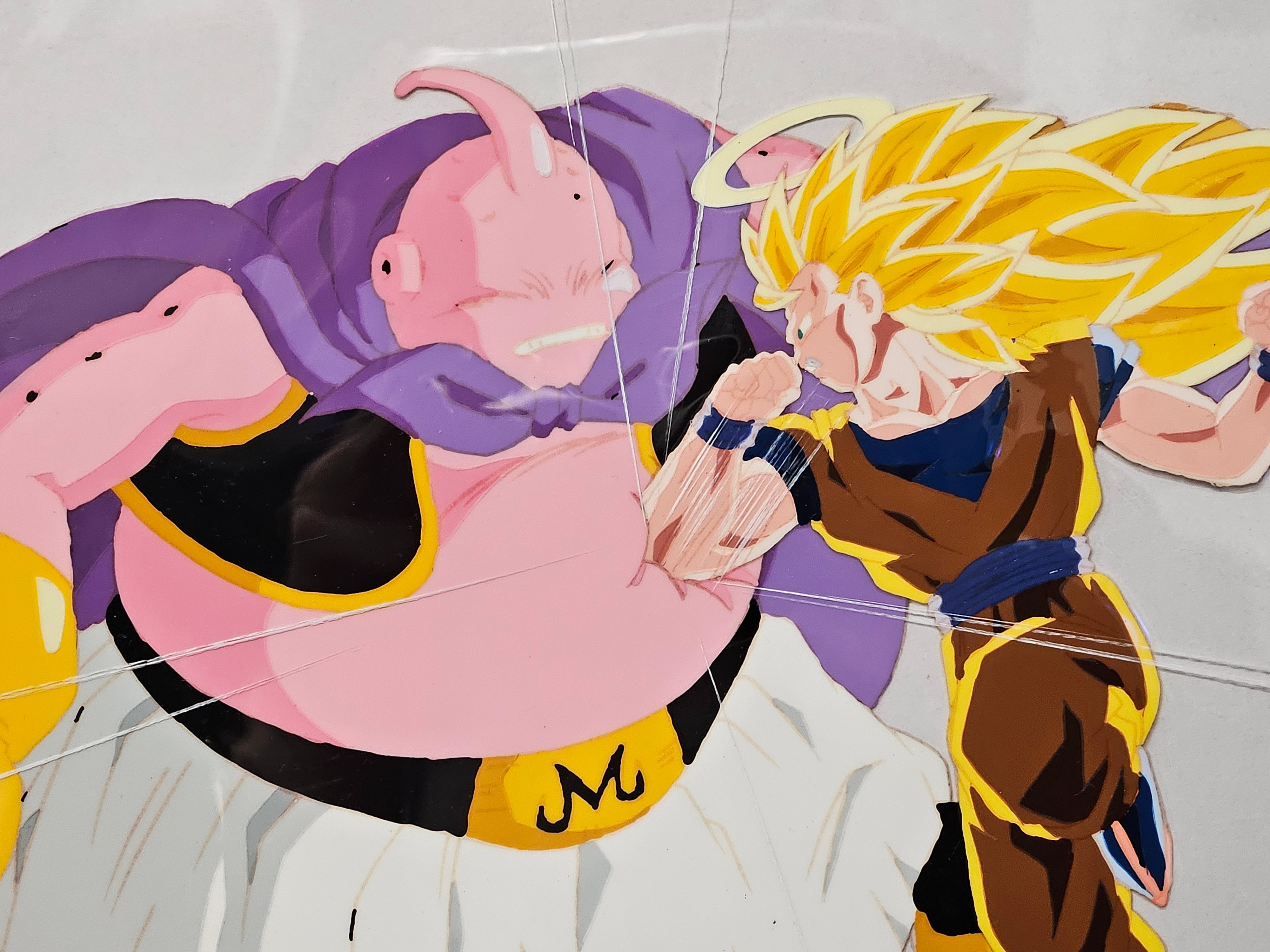 《龙珠》原版赛璐璐胶片与原画草图（魔人布欧 vs. 孙悟空）